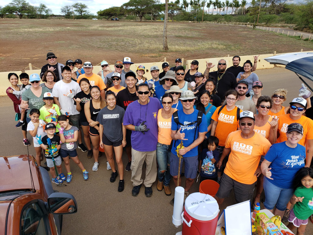 Volunteers with 808 Cleanups doing a beach and park cleanup in Hawaii